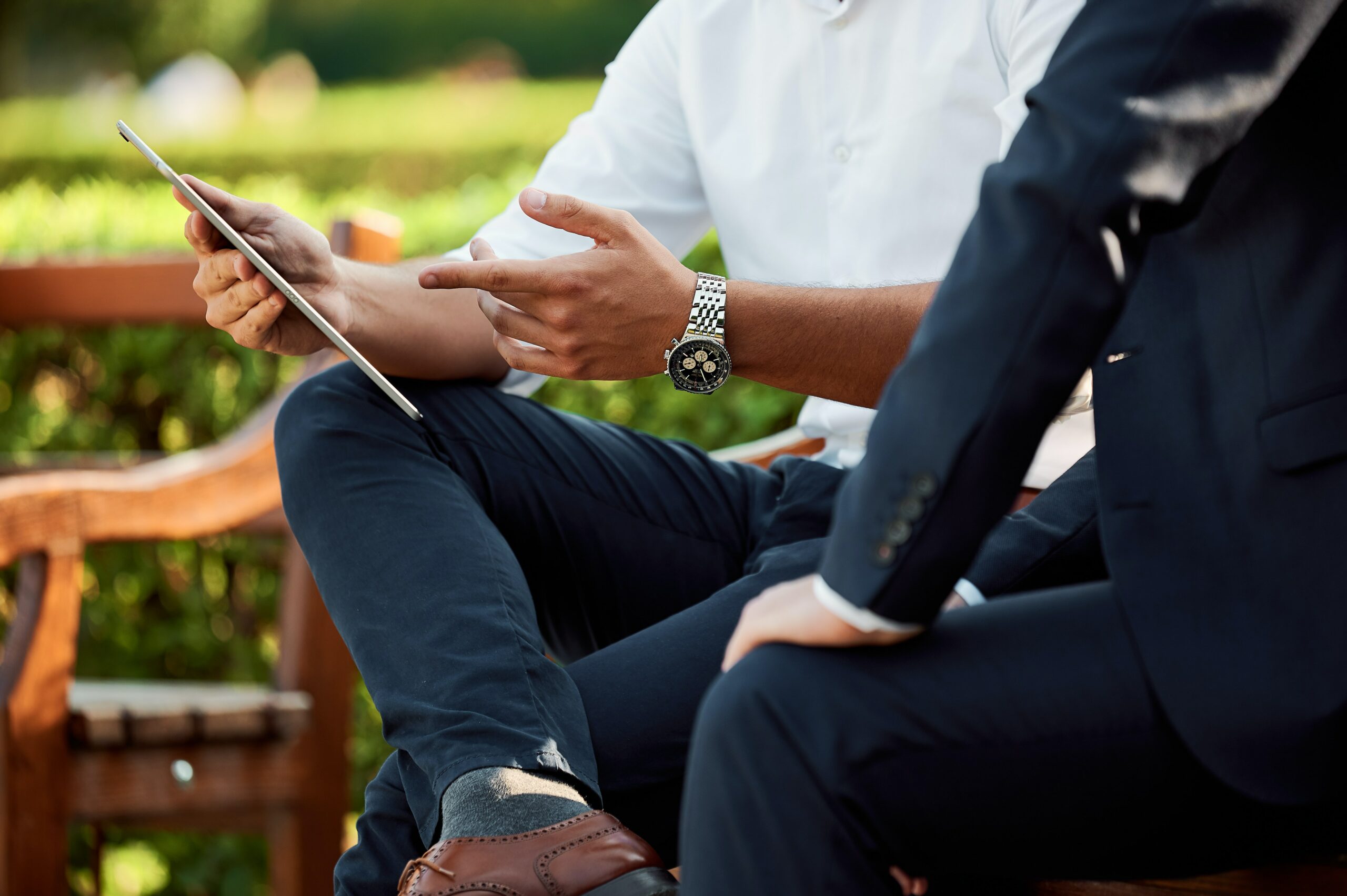 Two business men talking outside